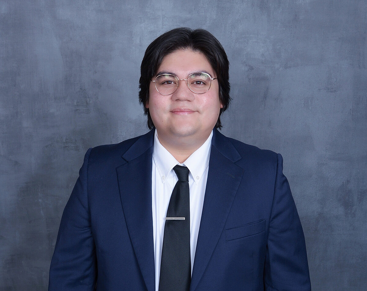 Professional headshot of Benjamin Gallegos, waist up.